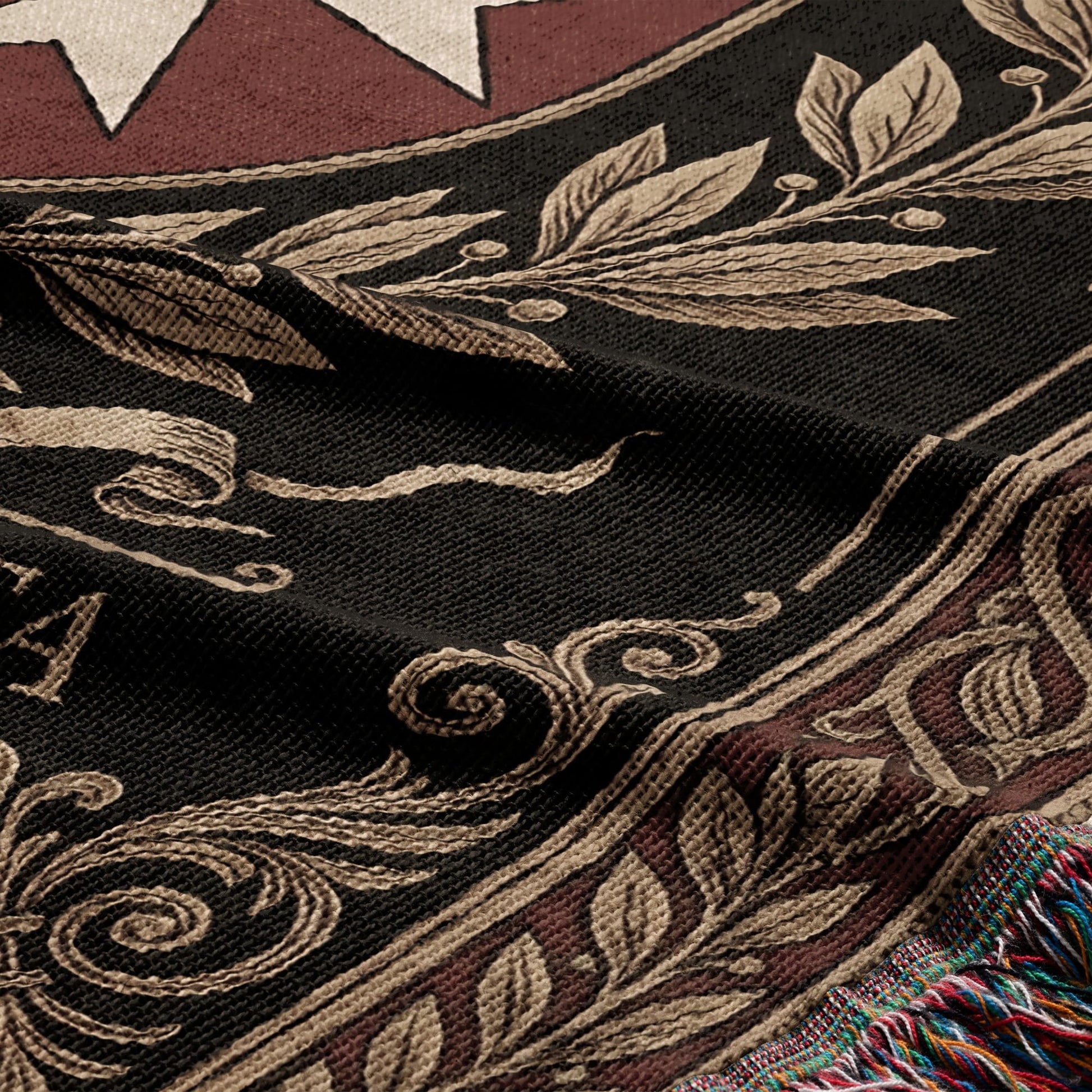 Black tapestry with laurel wreath and star design, fringed edge.
