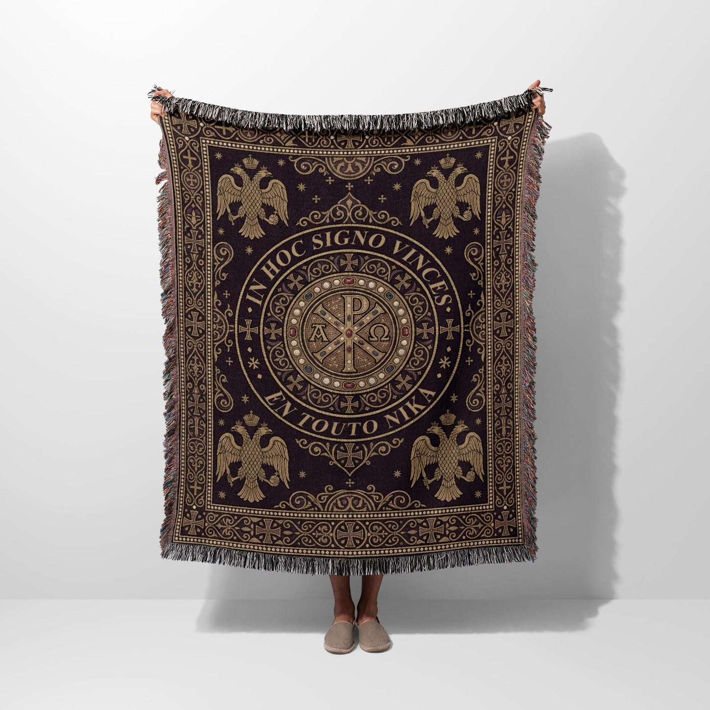 Dark woven blanket with central medallion, eagles, and Greek text "IN HOC SIGNO VINCES EN TOUTO NIKA".