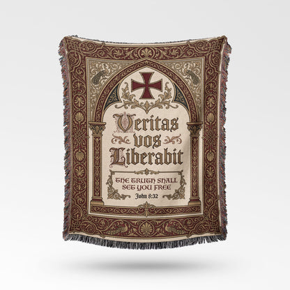Ornate blanket with Latin inscription and cross.