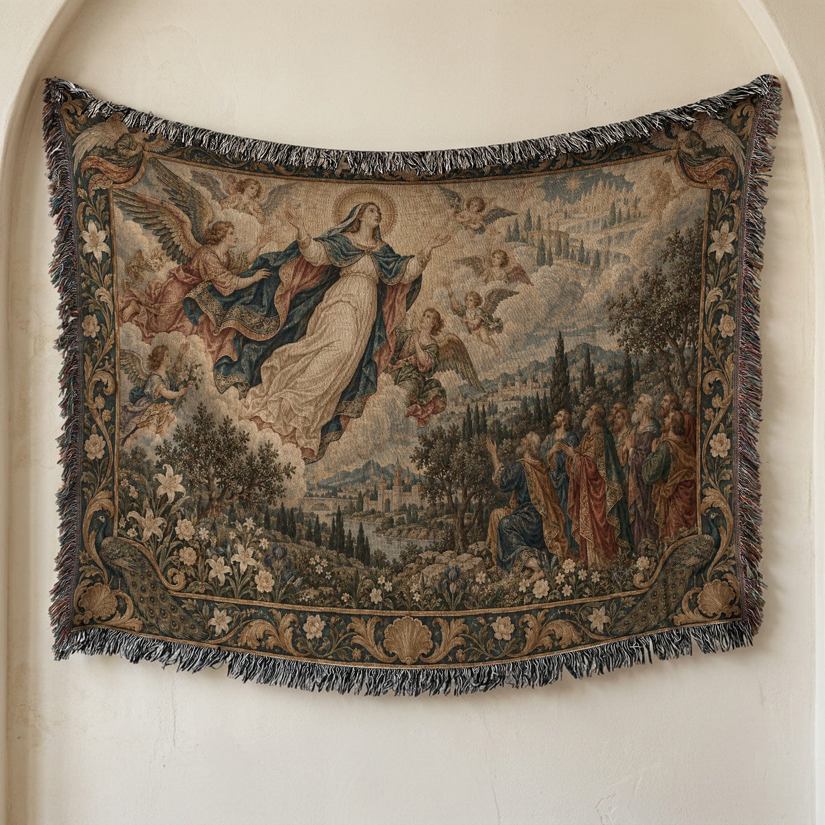 Woven tapestry hanging on a neutral wall, depicting the Assumption of Mary surrounded by angels and onlookers.