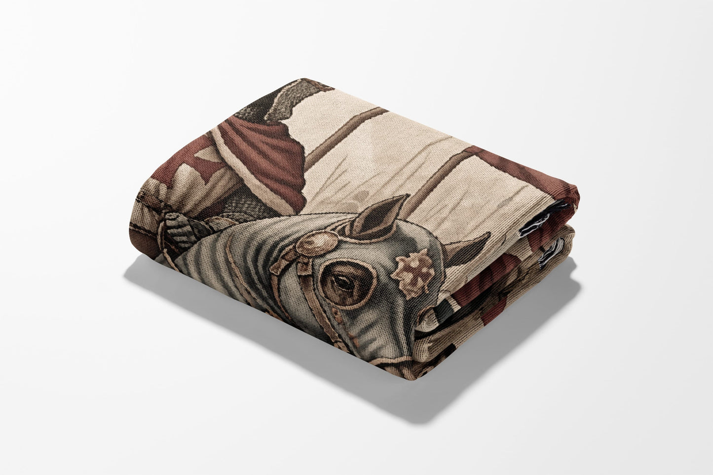 Folded blanket featuring a knight on horseback in armor.