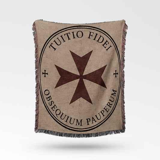Tapestry blanket with a Maltese cross and Latin text "TUITIO FIDEI OBSEQUIUM PAUPERUM."