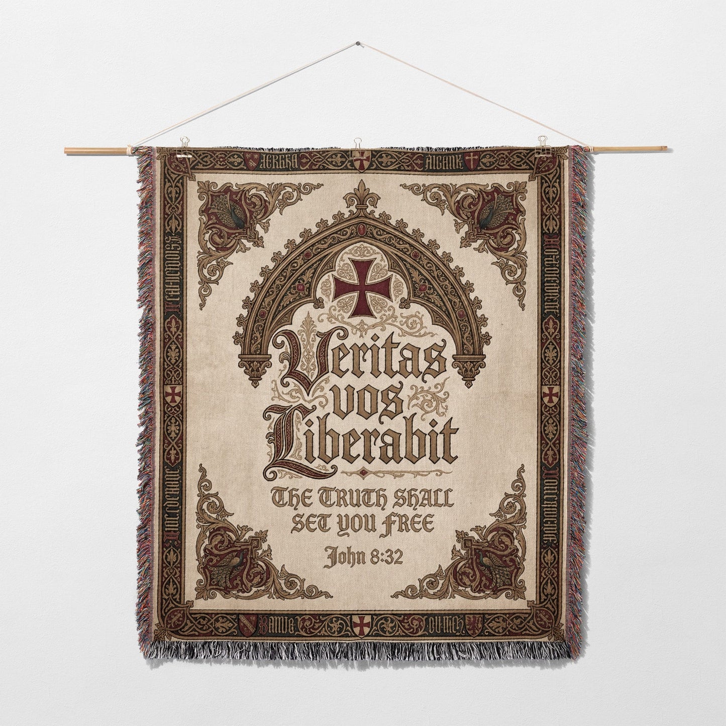 Tapestry with ornate border, featuring a cross and Latin text "Veritas vos liberabit" and "The truth shall set you free".