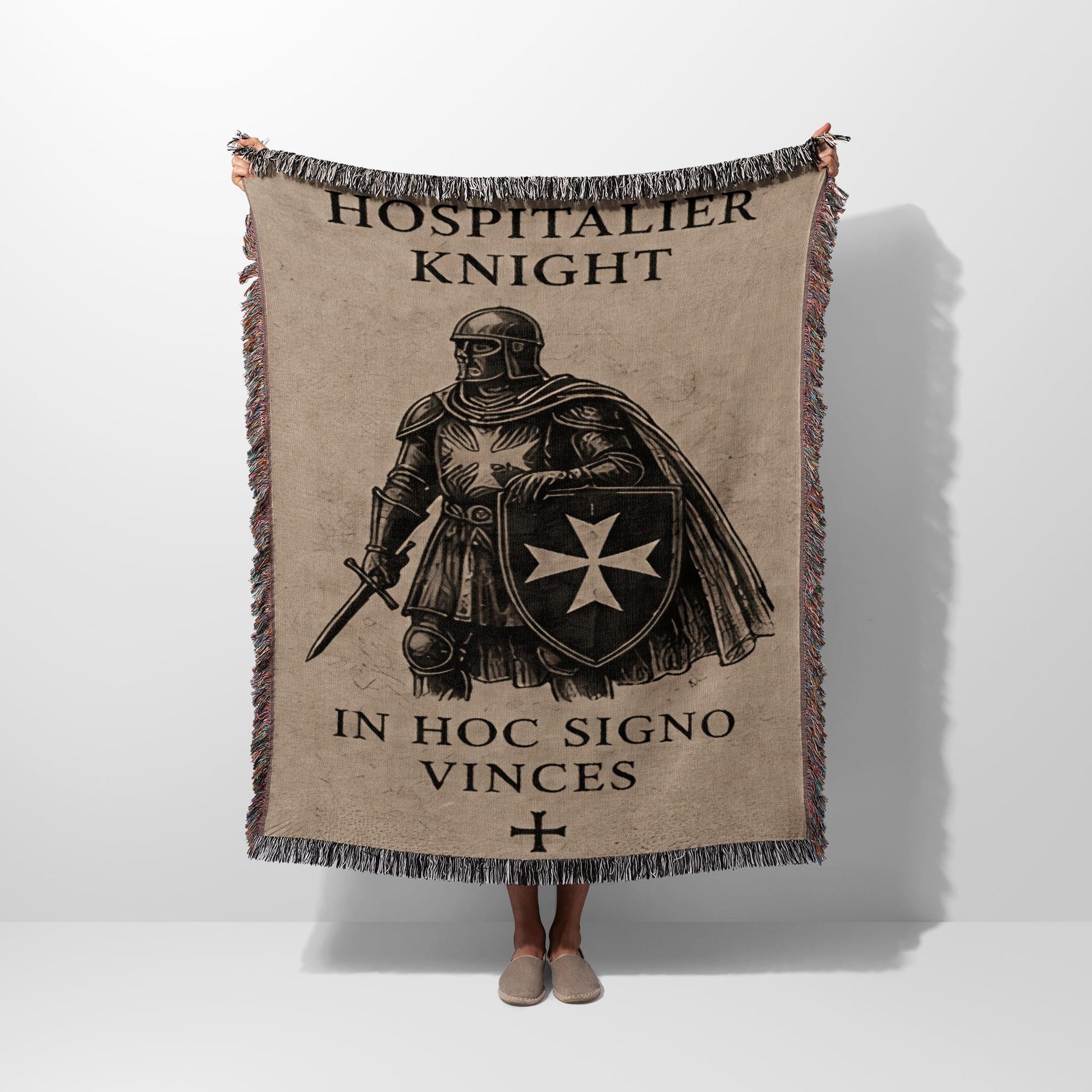 Blanket with Hospitalier Knight design, sword, shield, and text.