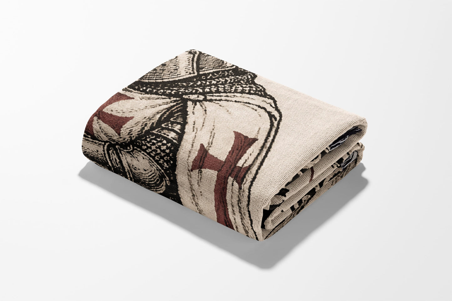 Folded tapestry blanket featuring a knight in armor with a red cross.
