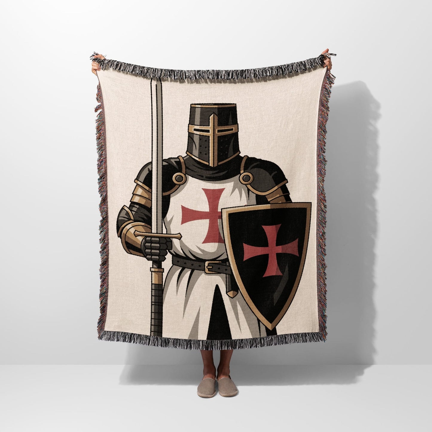 Tapestry featuring a knight in armor holding a sword and shield.