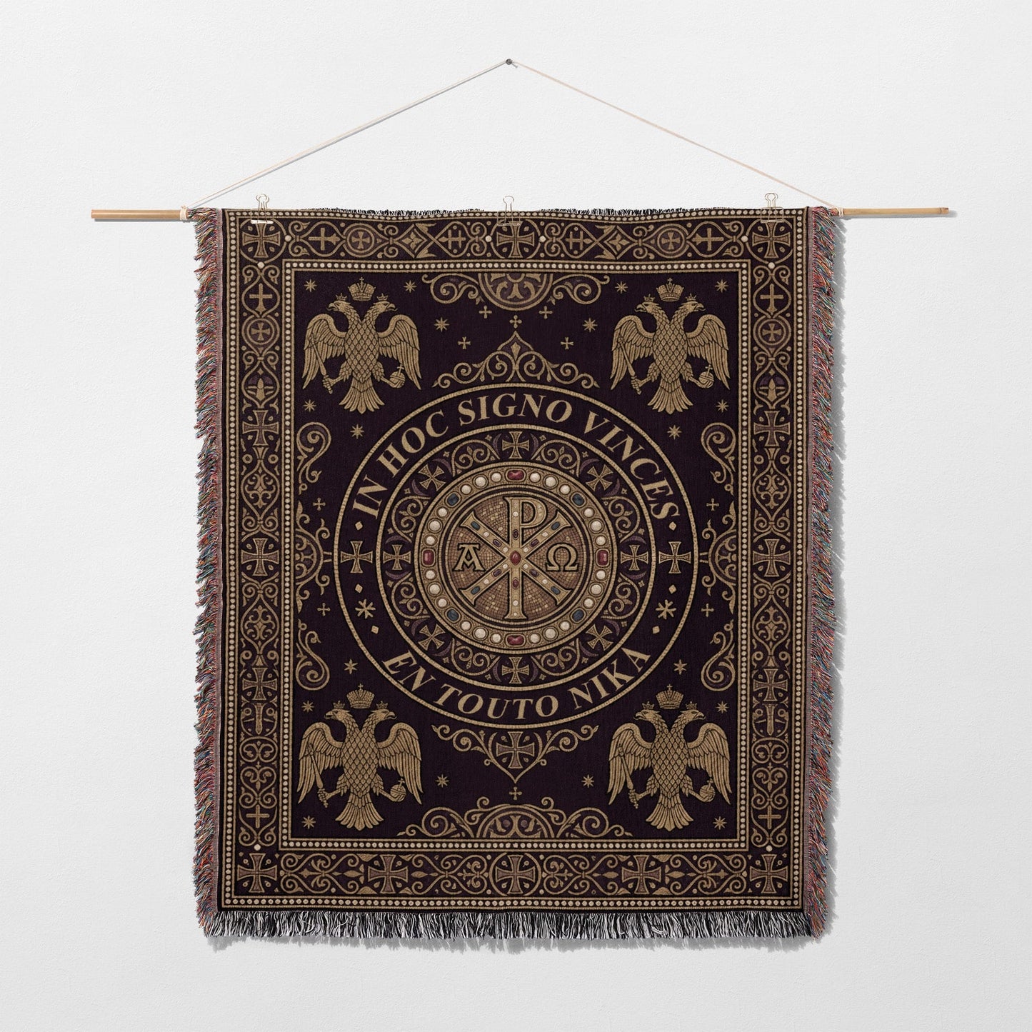 Dark tapestry with gold Byzantine eagles and Chi-Rho symbol, bearing Latin and Greek text.