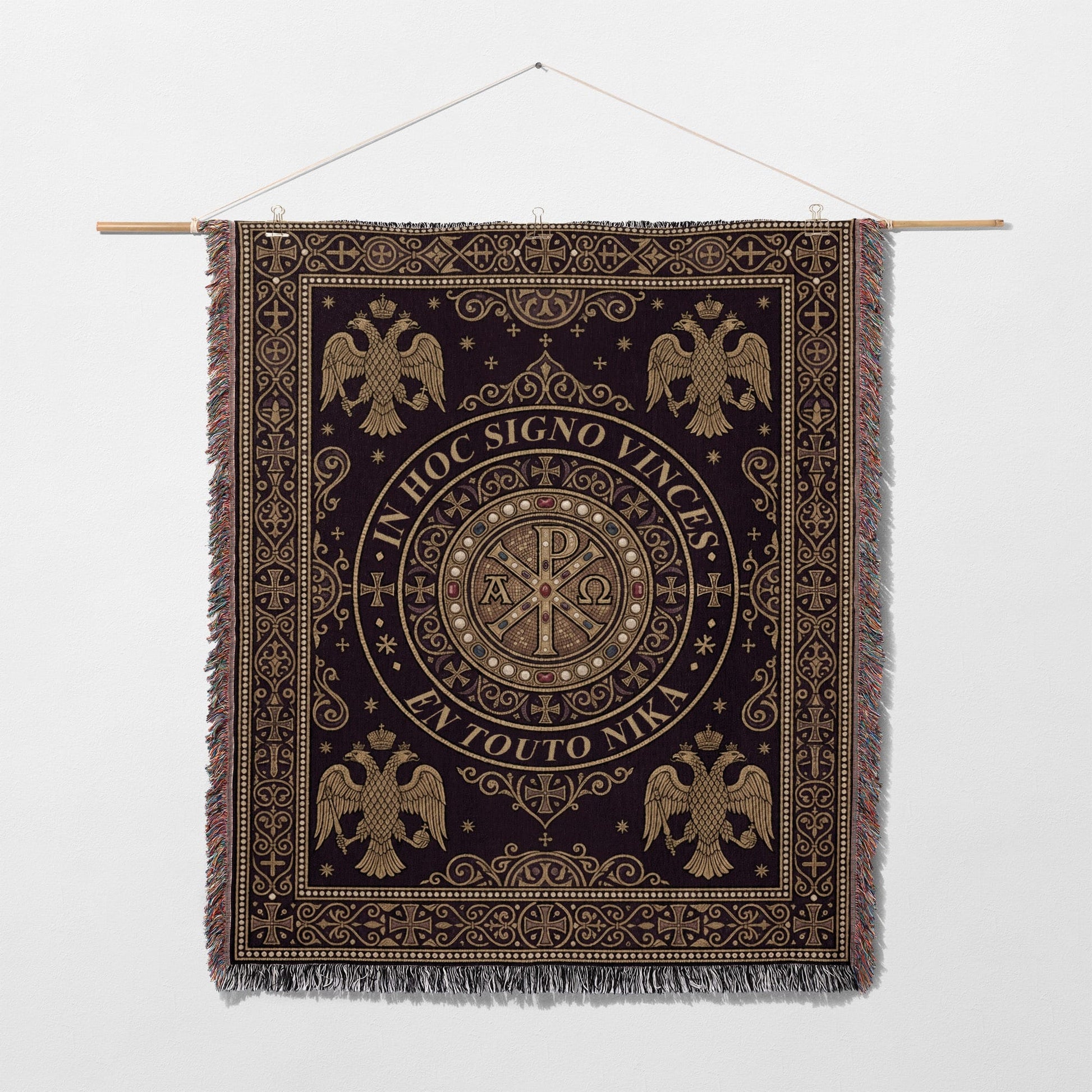 Dark tapestry with gold Byzantine eagles and Chi-Rho symbol, bearing Latin and Greek text.