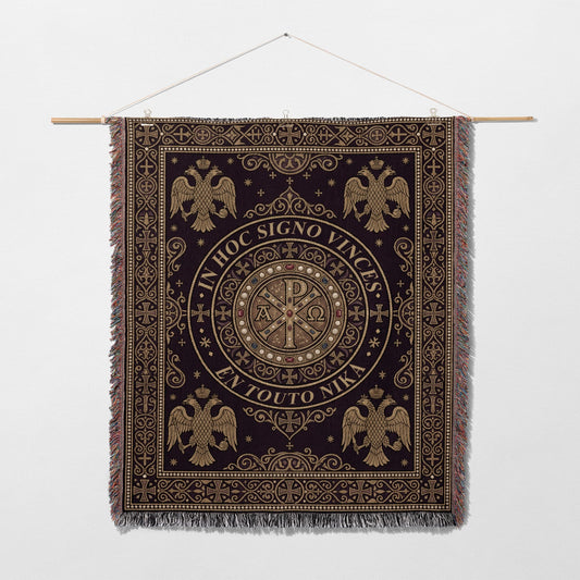 Dark tapestry with gold Byzantine eagles and Chi-Rho symbol, bearing Latin and Greek text.