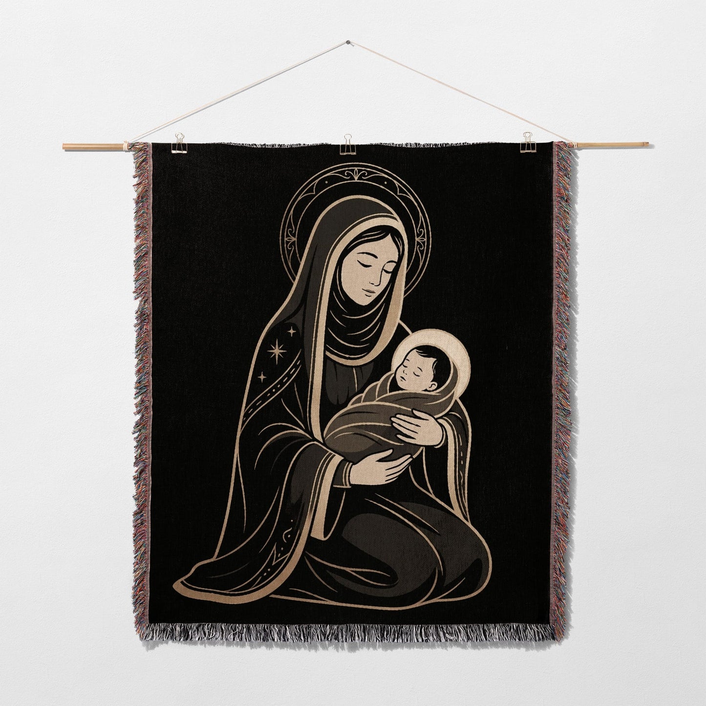 Religious tapestry depicting Mary holding baby Jesus, against black background.