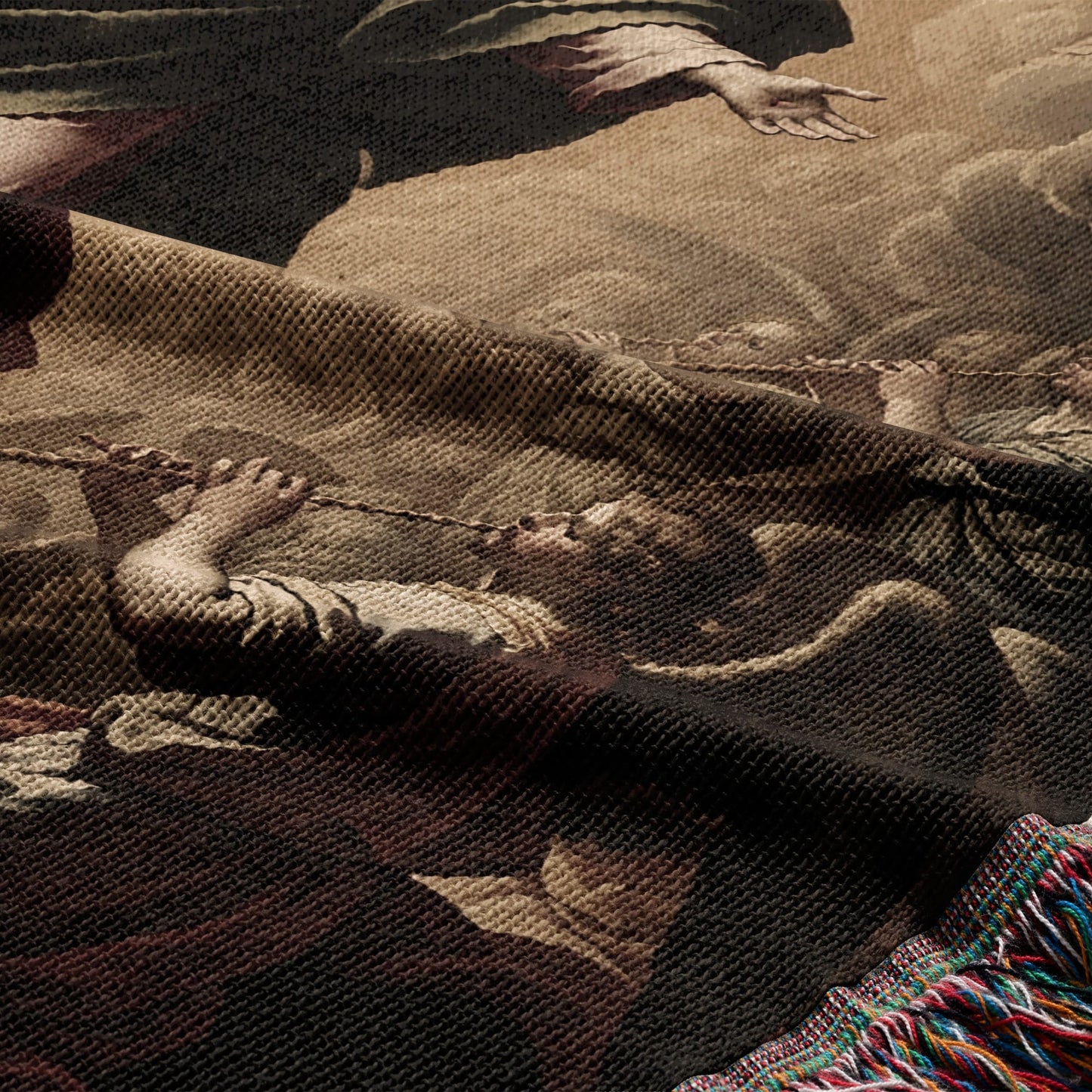 Tapestry detail showing a man pulling a rope, with fringe at the bottom.
