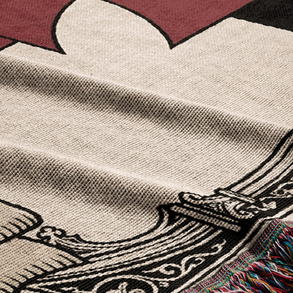 Cream textured blanket with black Viking ship pattern and fringed edge.