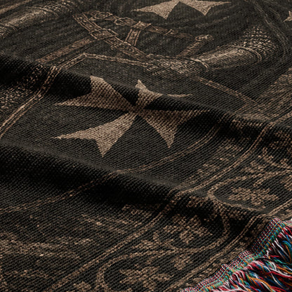 Black fabric with a taupe Maltese cross and chainmail pattern, fringed edge.