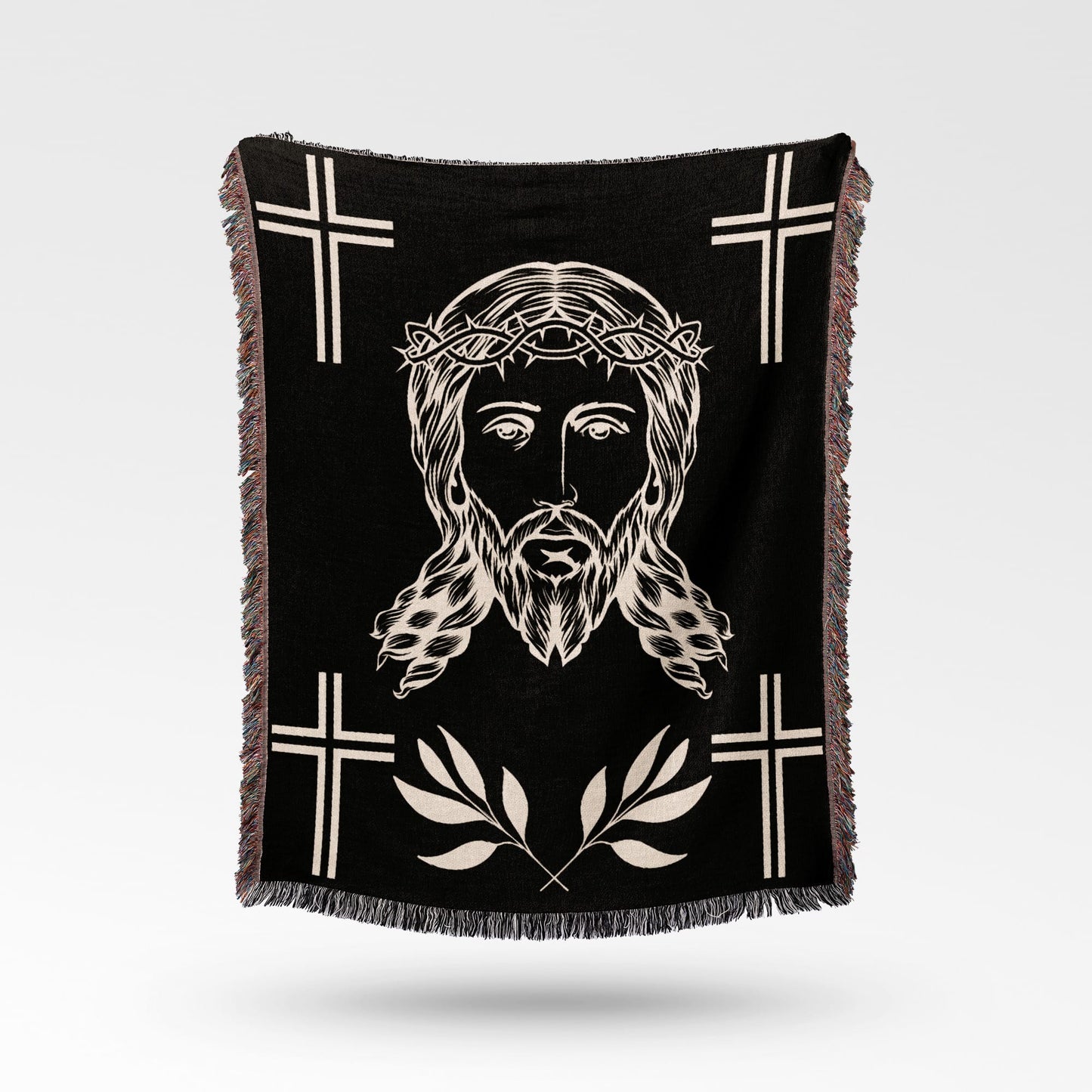 Black throw blanket with Jesus' face, crown of thorns, and crosses.