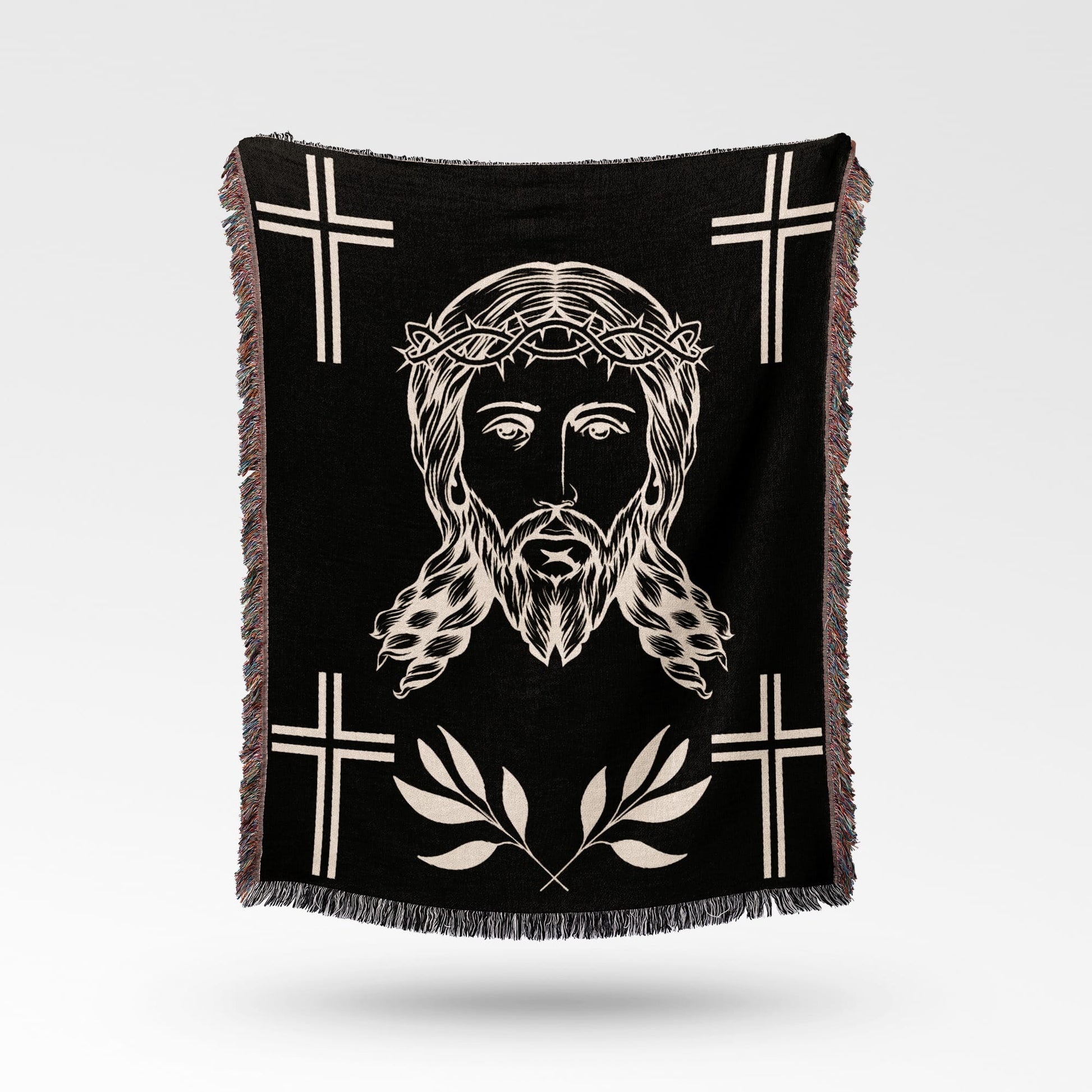 Black throw blanket with Jesus' face, crown of thorns, and crosses.