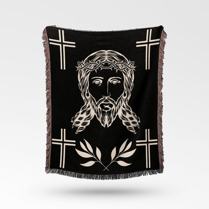 Black throw blanket with Jesus' face, crown of thorns, and crosses.
