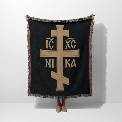 Black throw blanket with gold Orthodox Christian cross and text.