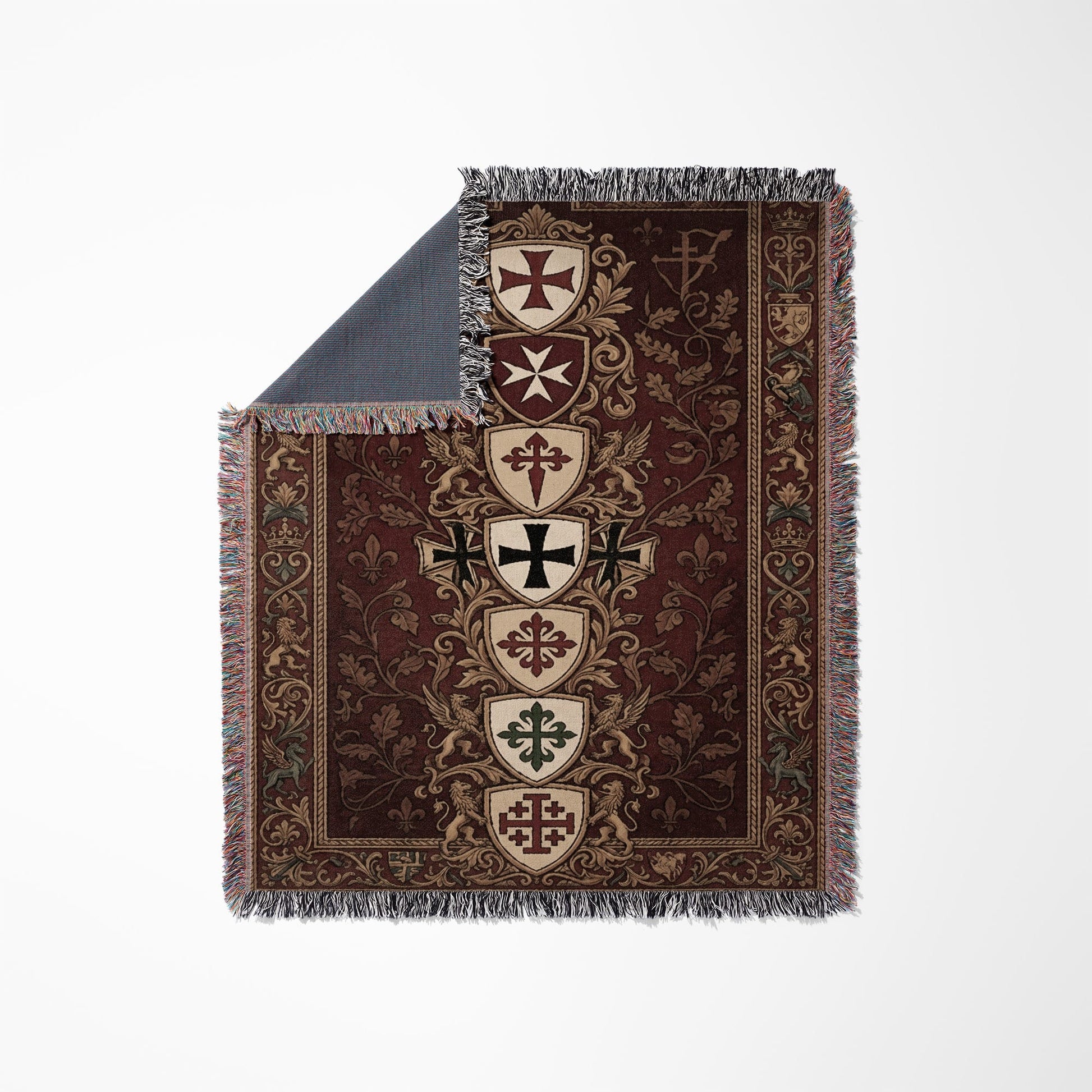 Brown tapestry throw with fringed edges and medieval heraldic crests.