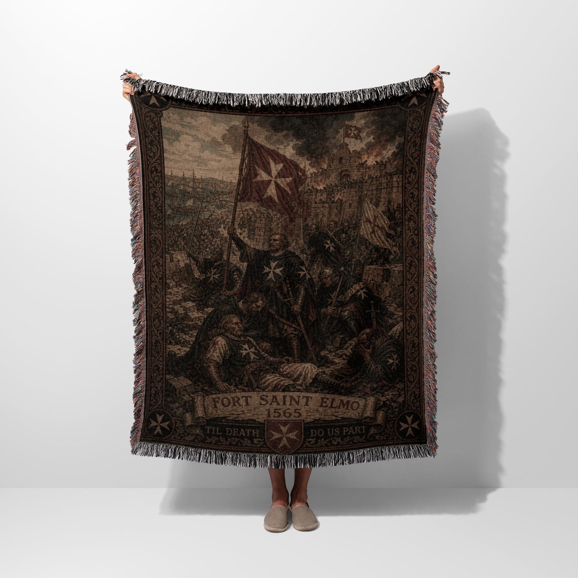 Woven tapestry depicting a battle scene with knights and banners, text reads "Fort Saint Elmo Til Death Do Us Part".