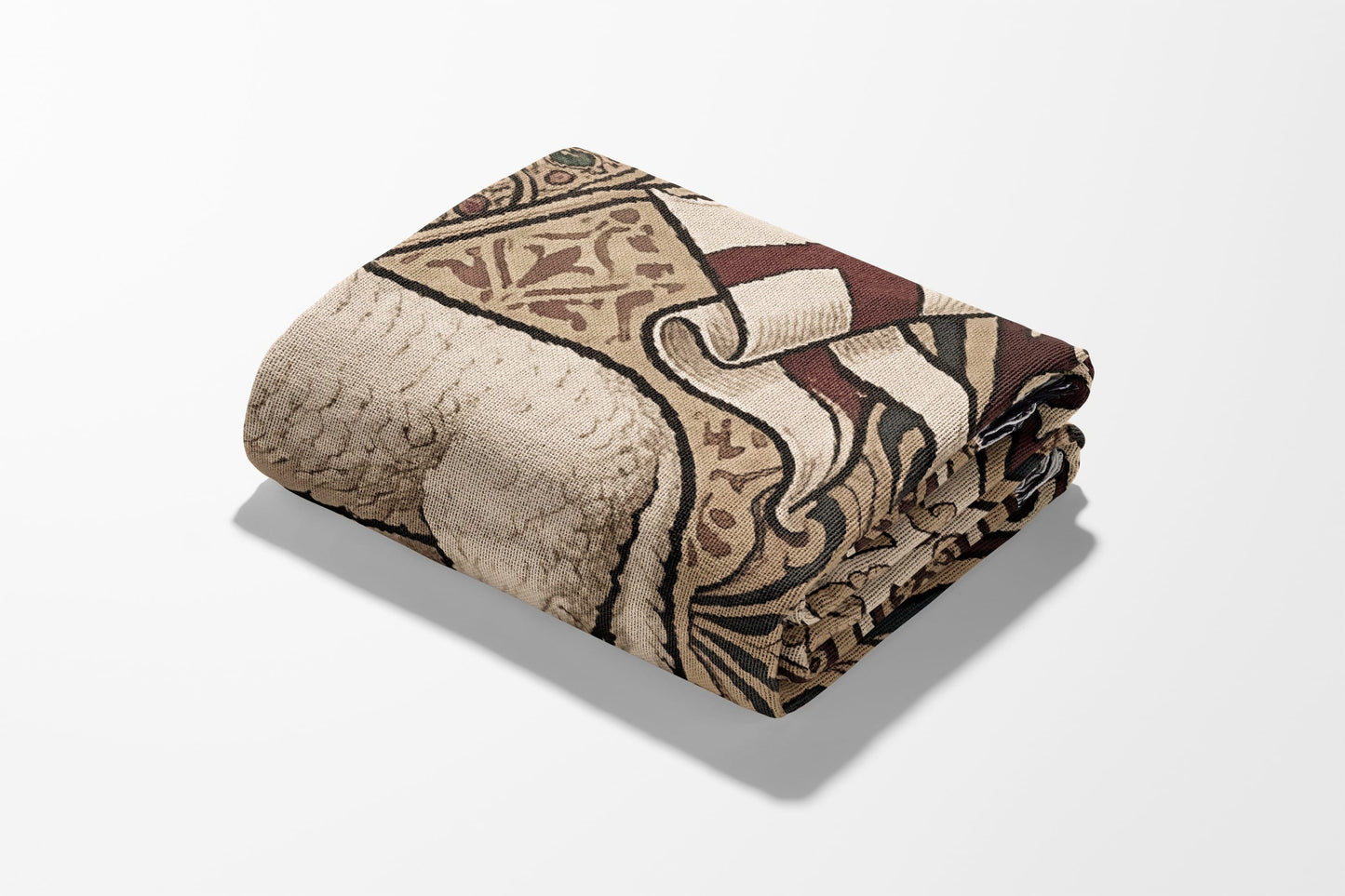 Folded beige and brown patterned blanket with a shadow.