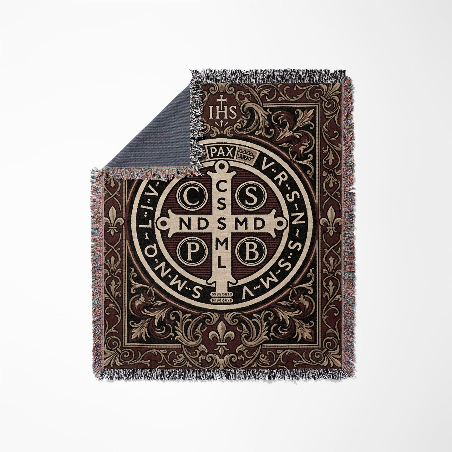 Throw blanket with St. Benedict medal design and ornate border.