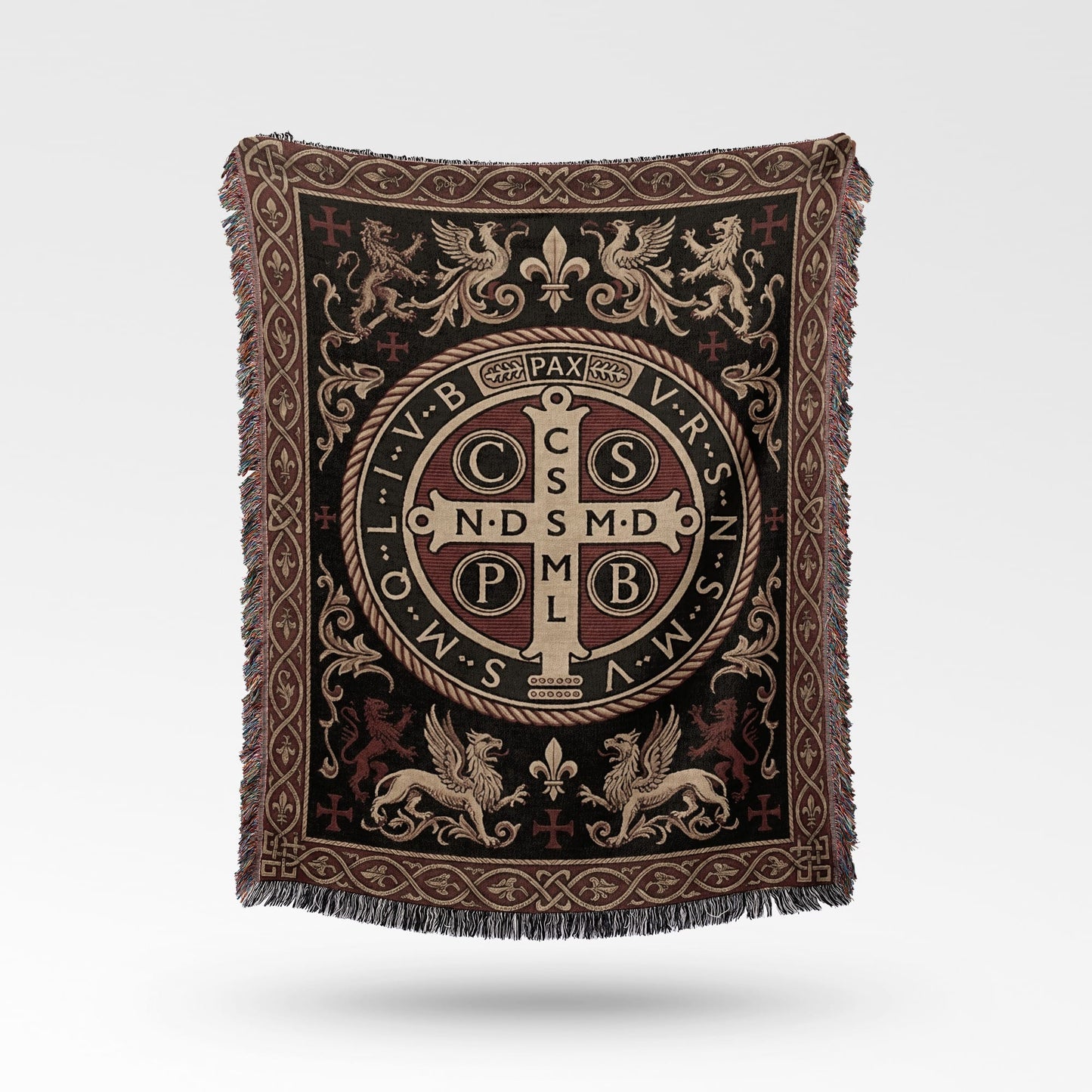 Woven throw blanket with Saint Benedict medal, griffins, and fleur-de-lis.