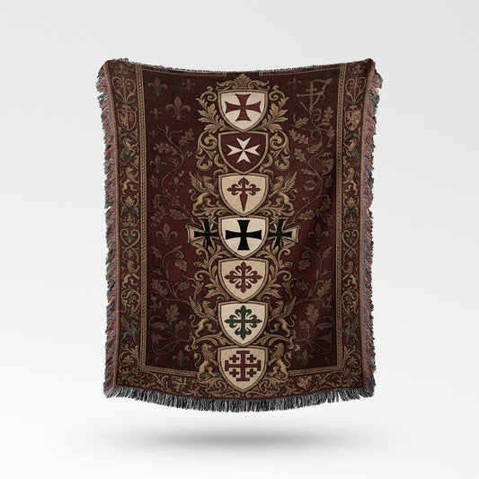 Tapestry throw with medieval crests, fleur-de-lis, and griffins on maroon background.