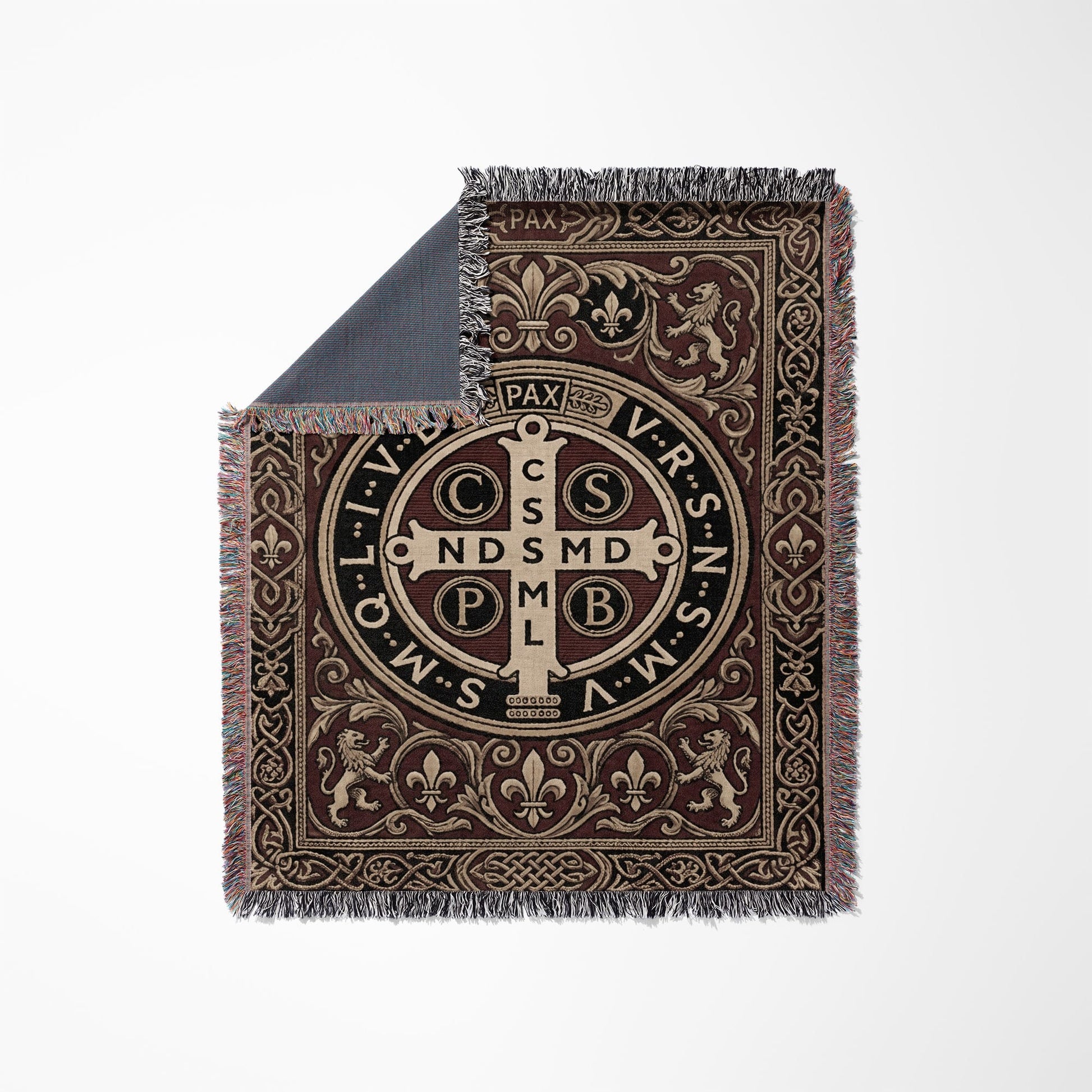 Woven tapestry blanket featuring the St. Benedict medal and ornate medieval border.