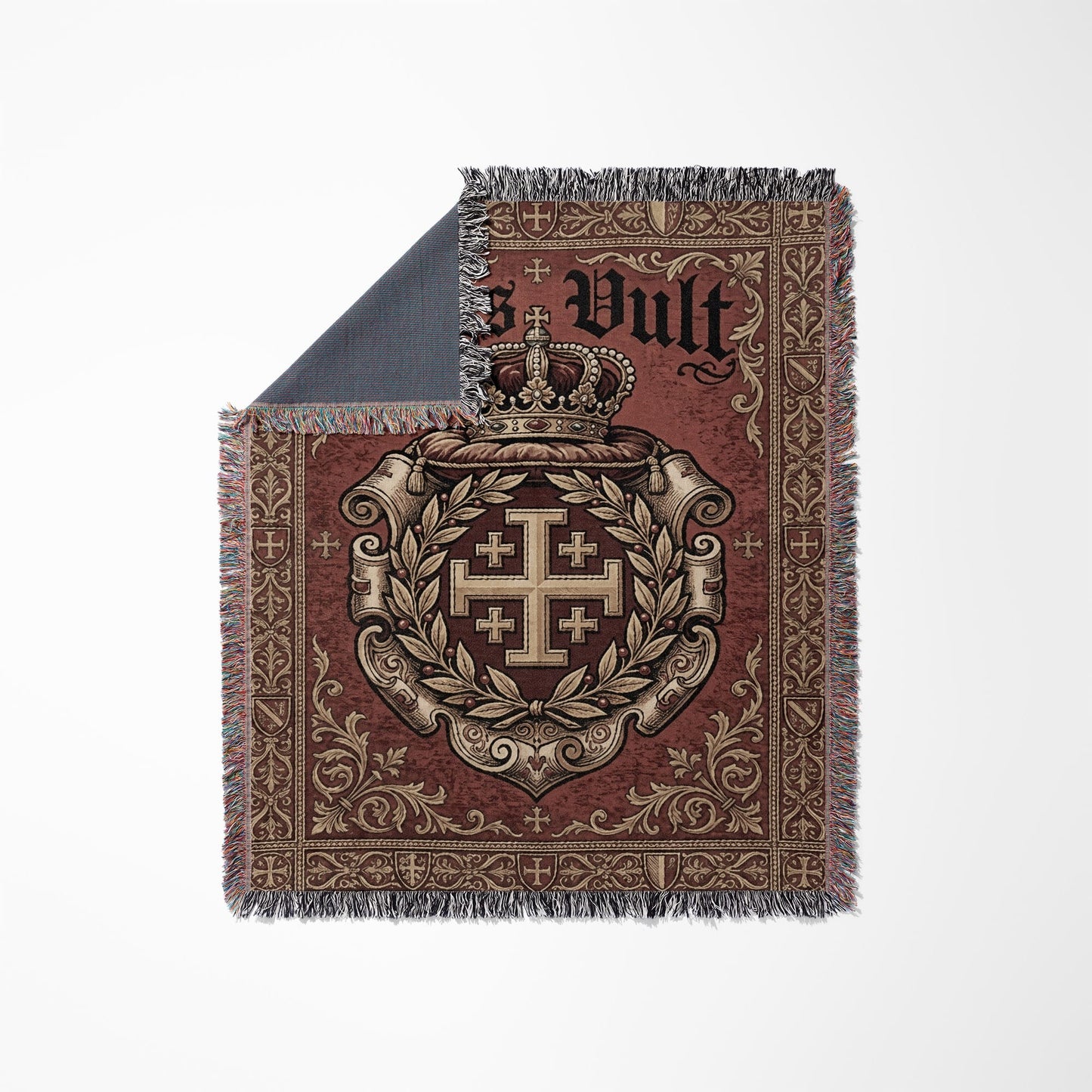 Woven blanket with a crown, cross of Jerusalem, and "Vult" text on a red background.