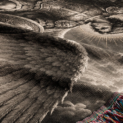 A textured woven blanket with a sepia-toned classical artistic print and colorful fringe.