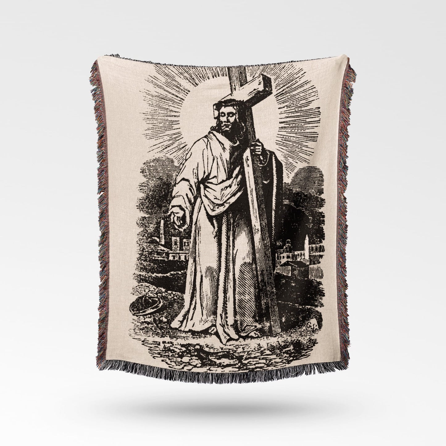 Jesus Christ carrying the cross on a textured, fringed throw blanket.