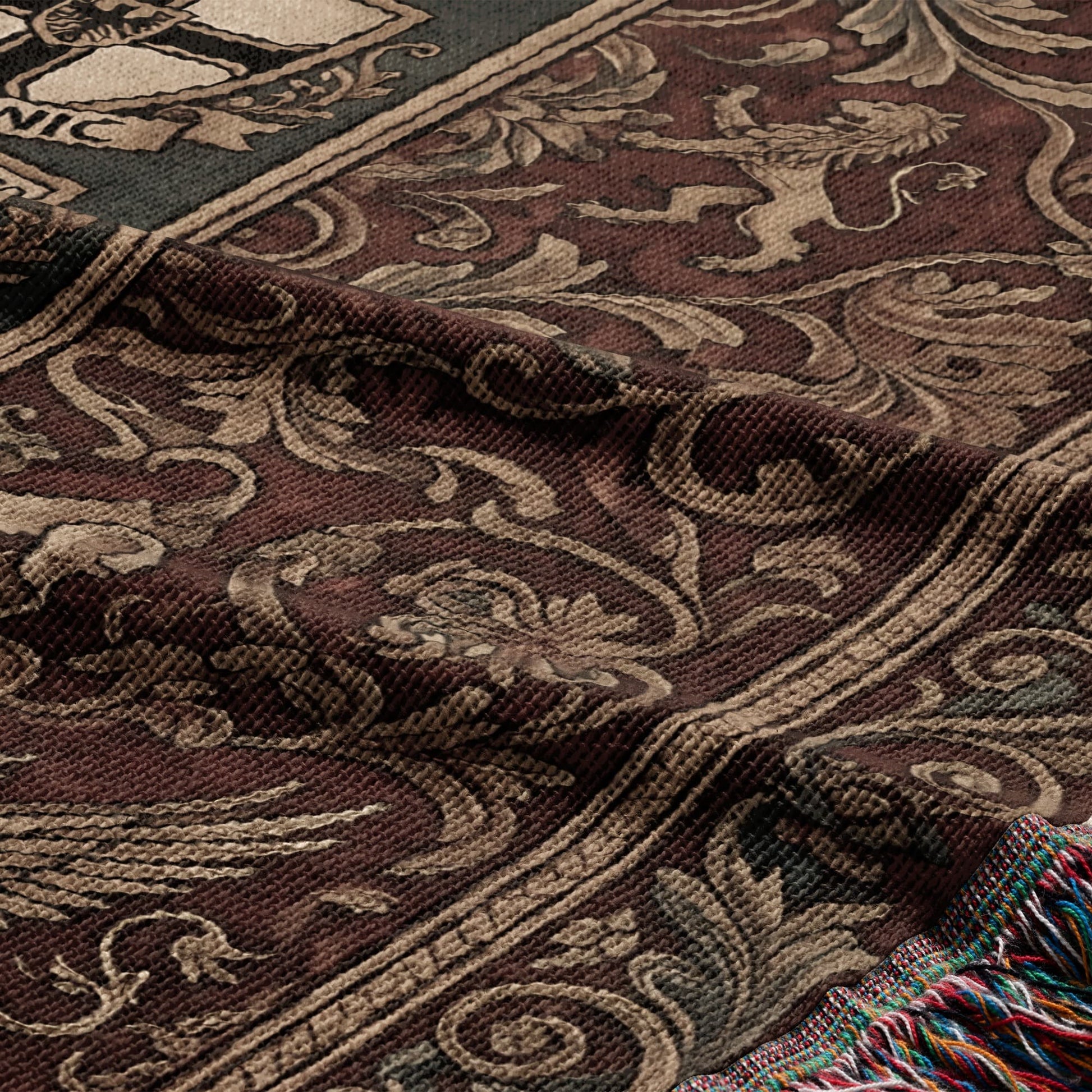 Tapestry blanket with ornate scrolling pattern and lions, with colorful fringe.