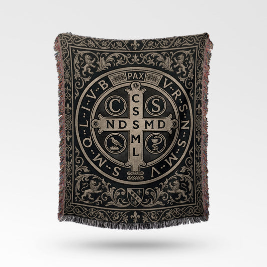 Woven blanket with St. Benedict medal design and ornate border.