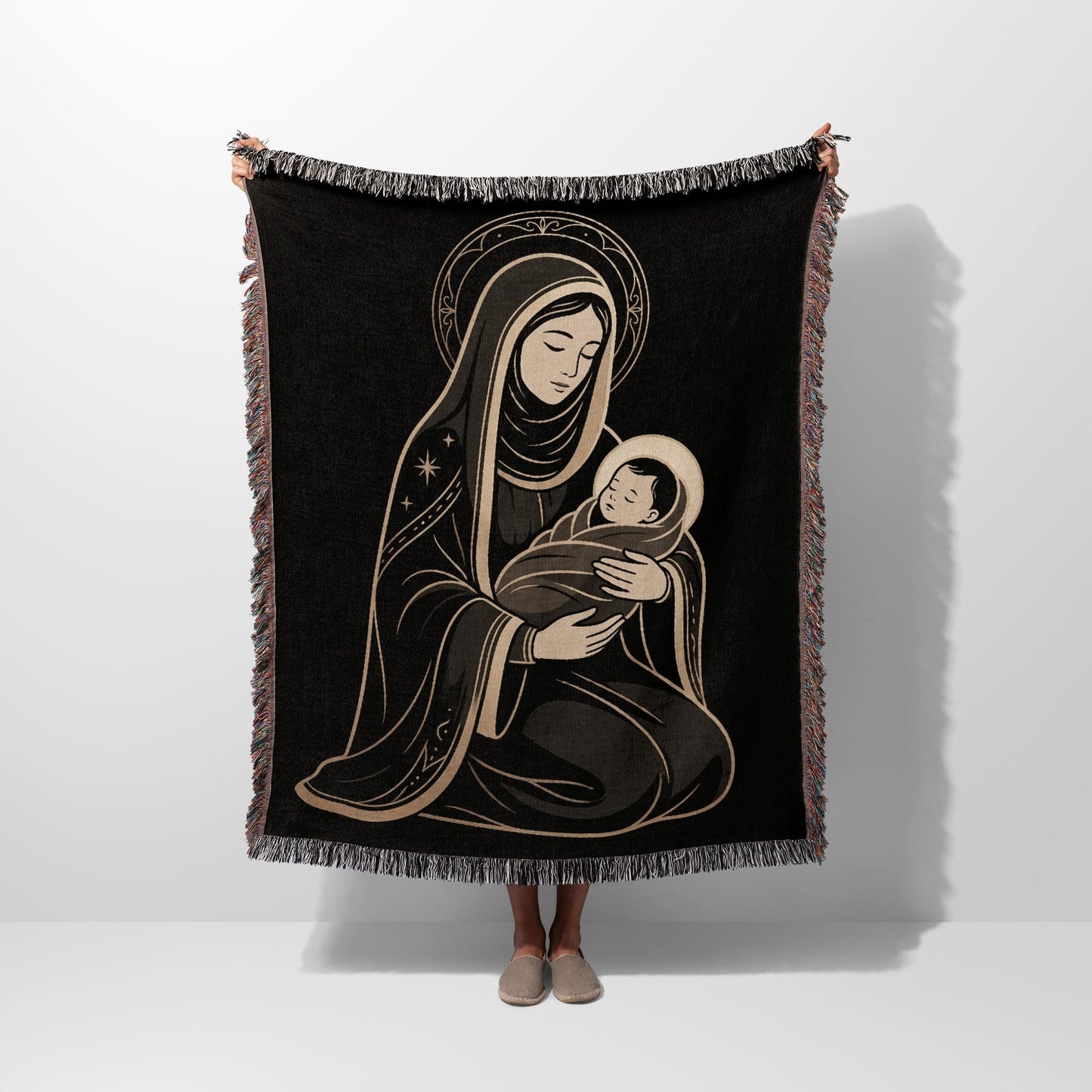 Tapestry with a depiction of Mary holding the infant Jesus.