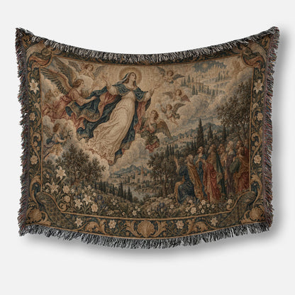A woven tapestry throw blanket depicting the Assumption of the Virgin Mary with angels and onlookers below.