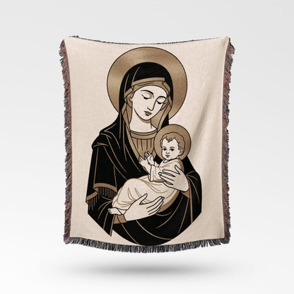 Blanket featuring religious illustration of Mary holding baby Jesus.