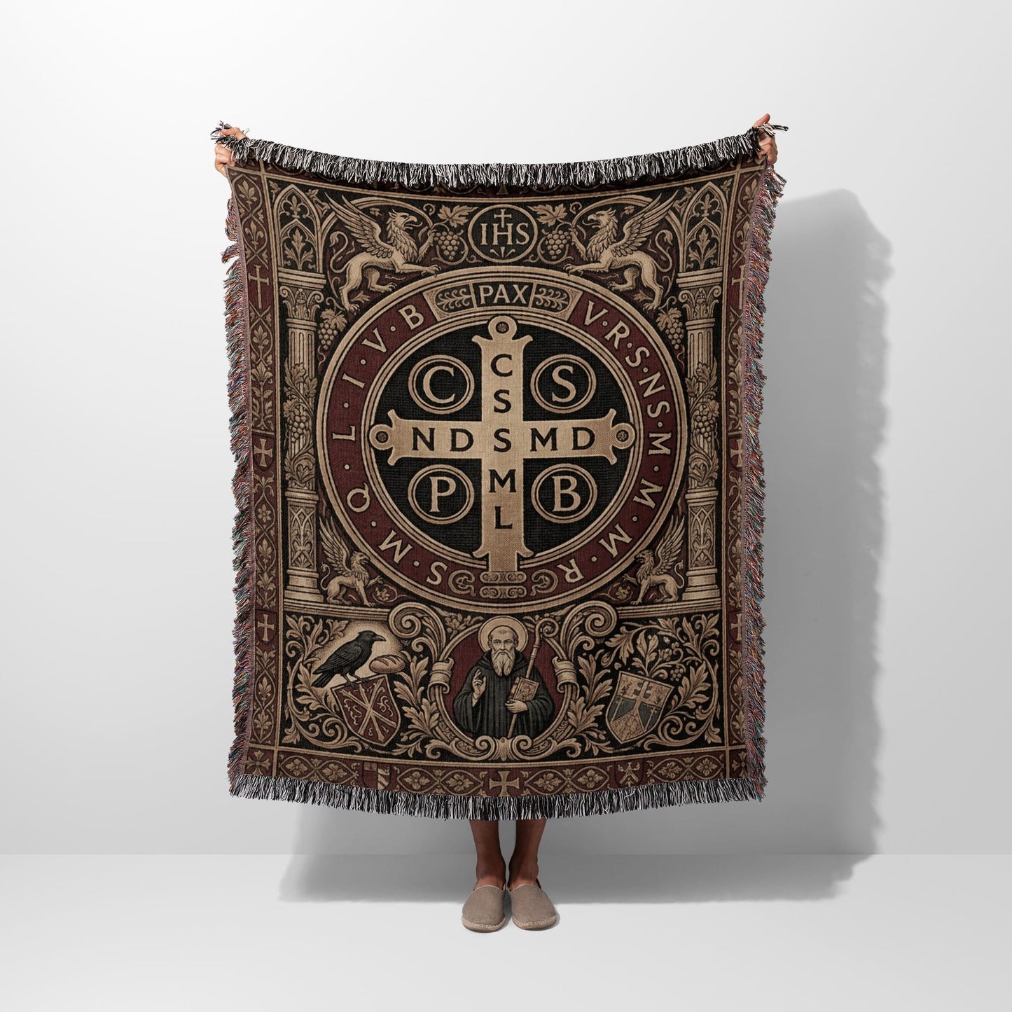 Woven throw with Saint Benedict medal design, IHS, and PAX text.