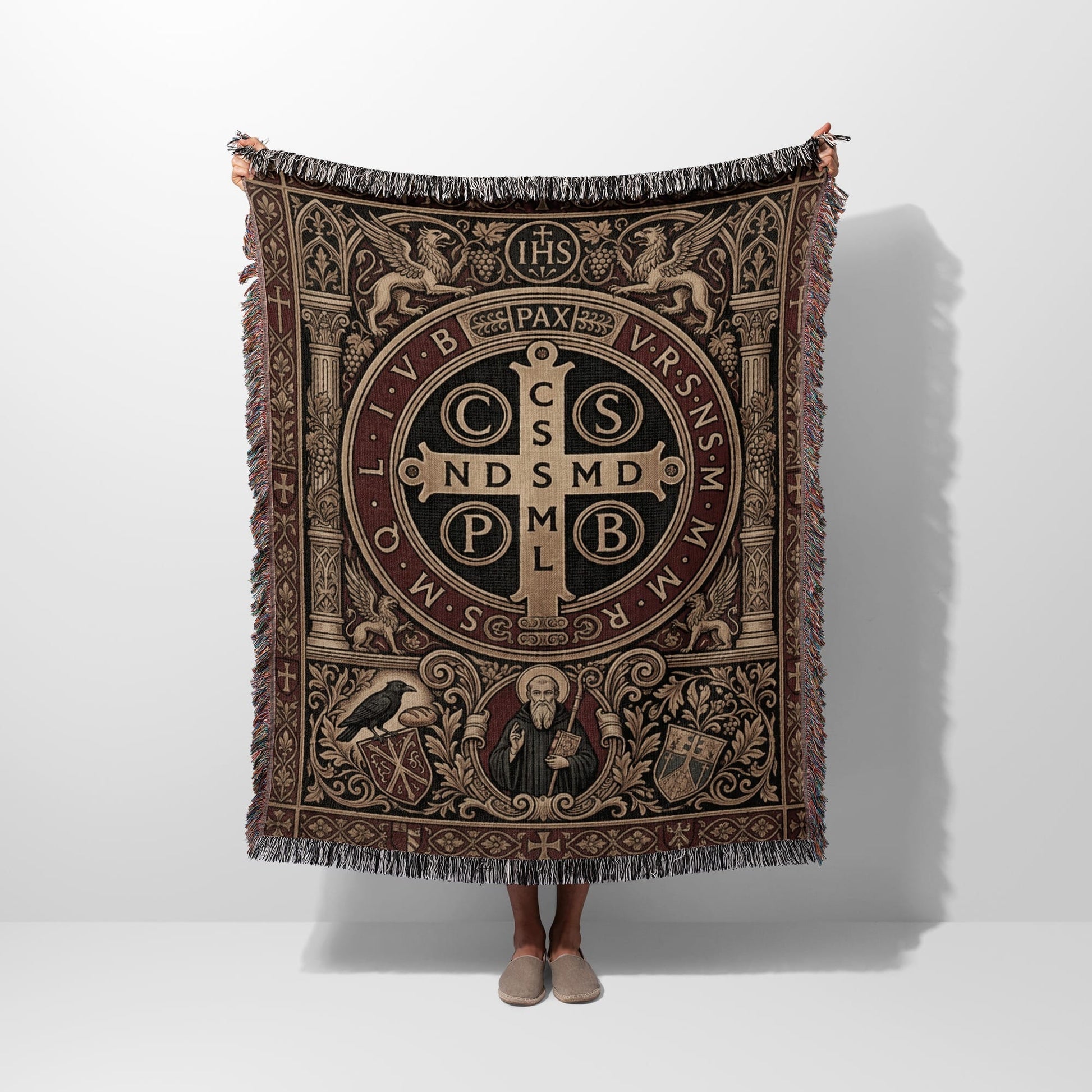 Woven throw with Saint Benedict medal design, IHS, and PAX text.