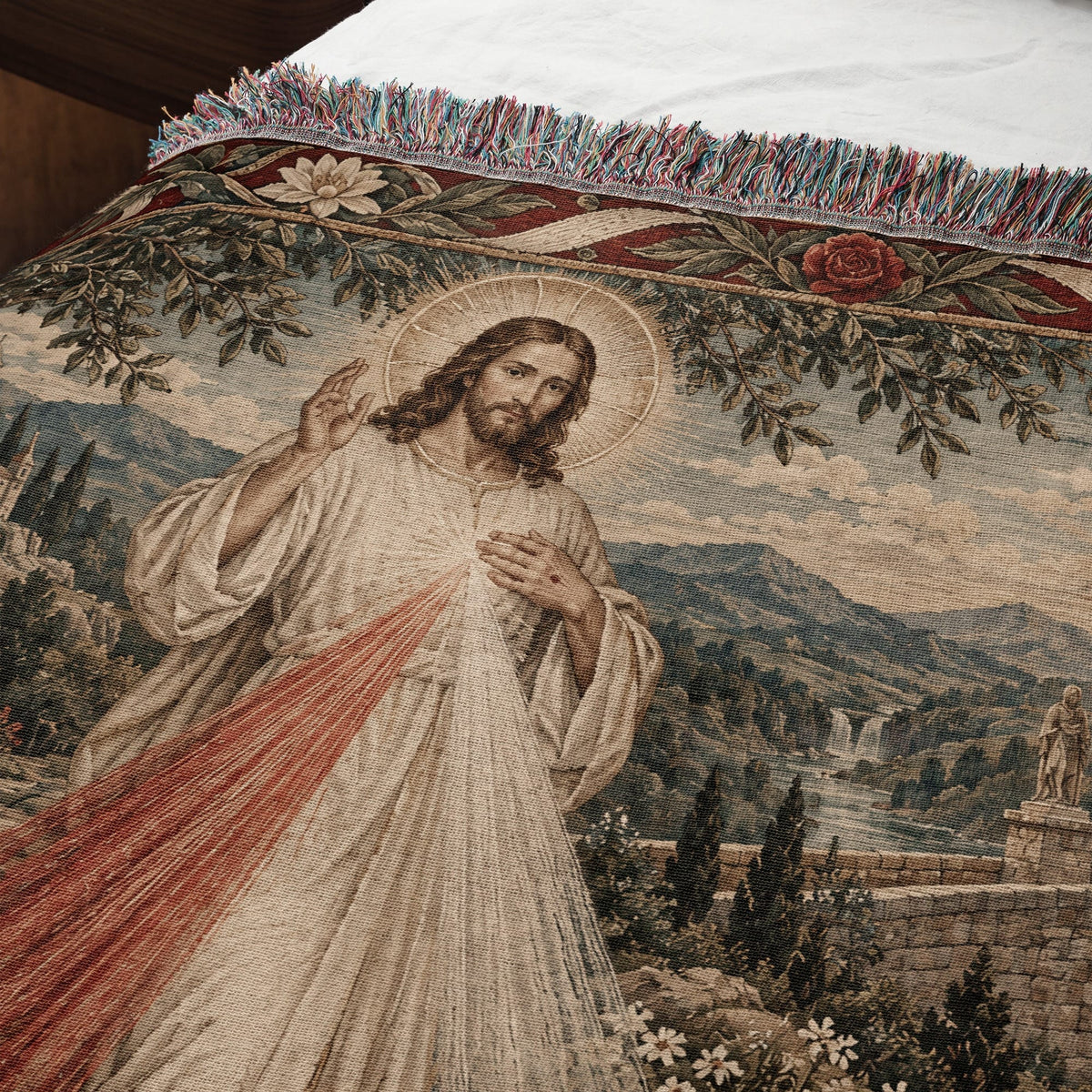 Woven throw blanket featuring the Divine Mercy Jesus with radiating red and white light rays.