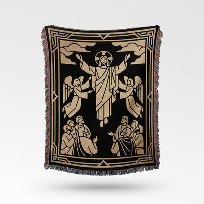 Jesus with outstretched arms surrounded by angels and people, on a black woven blanket.