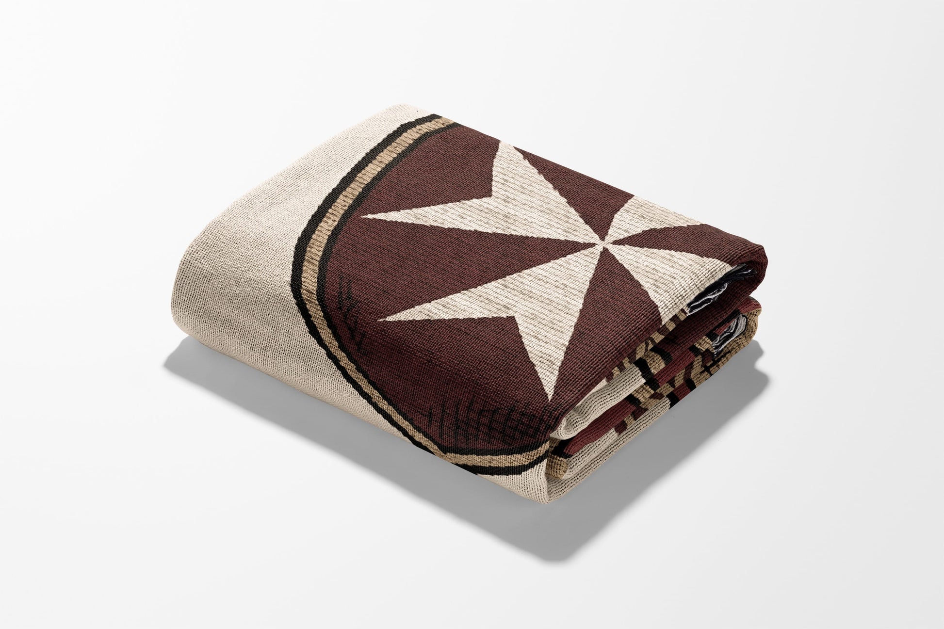 Folded blanket with brown and beige star pattern and striped border.