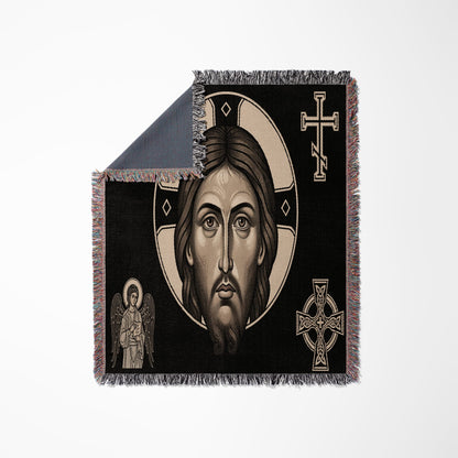 Black throw blanket with Jesus Christ's face, an angel, and Celtic cross motifs.