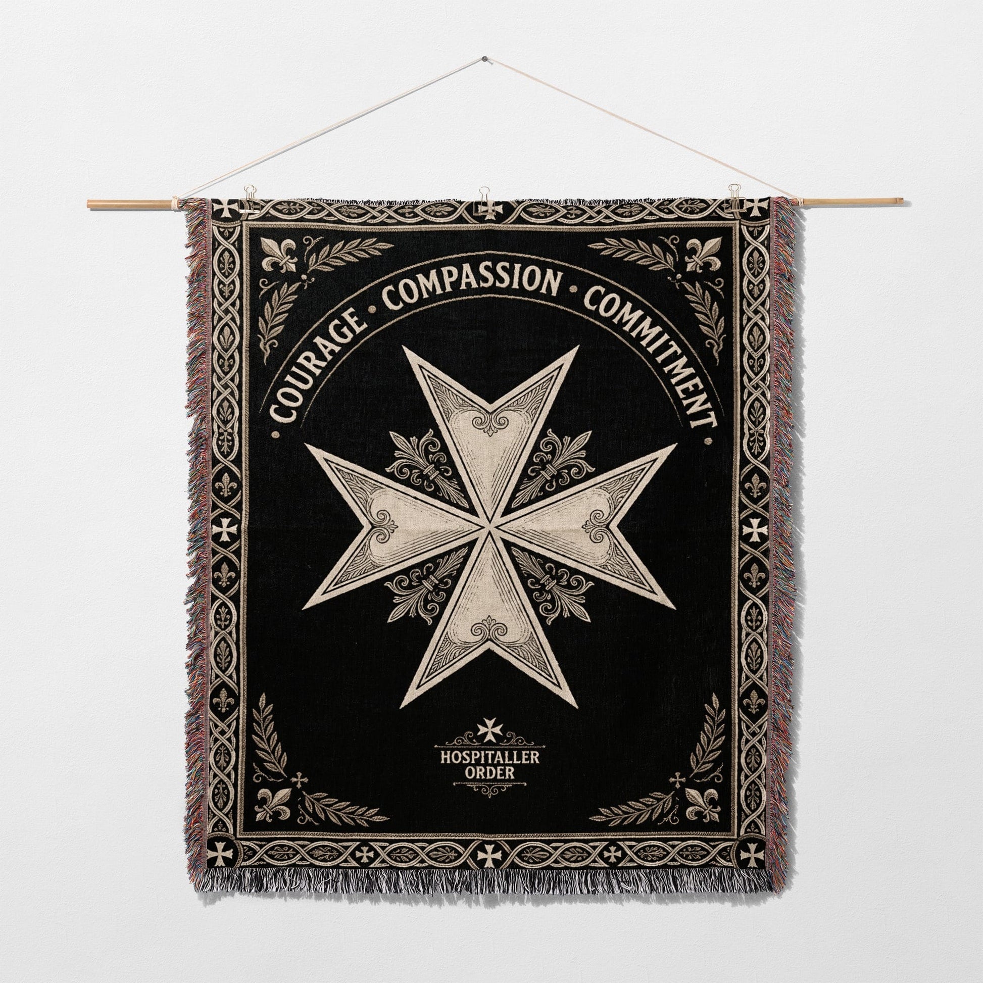 Black woven tapestry with a white Maltese cross and inscribed text.