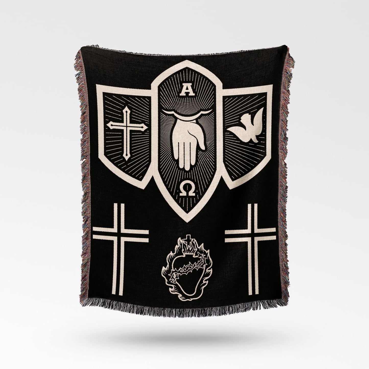 Black woven blanket with religious symbols: cross, dove, hand, omega, and sacred heart.
