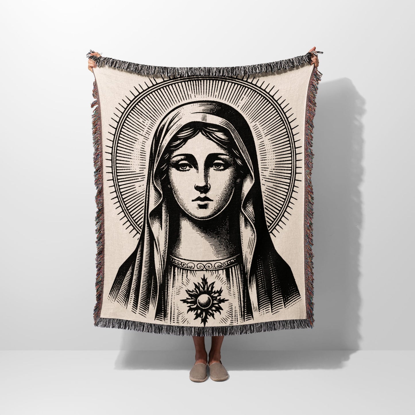 Virgin Mary blanket with halo and radiant sun motif.