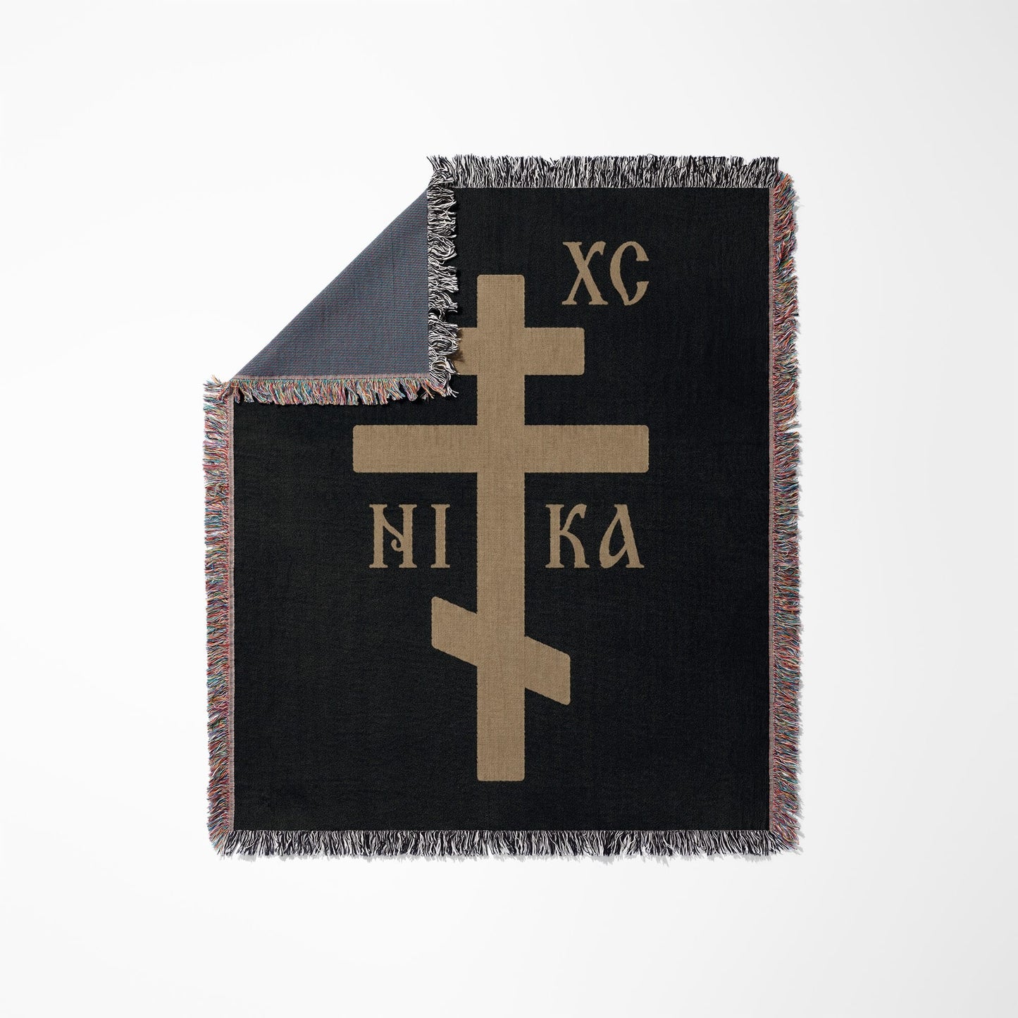 Black throw blanket with a tan Orthodox Christian cross and "XC NI KA".