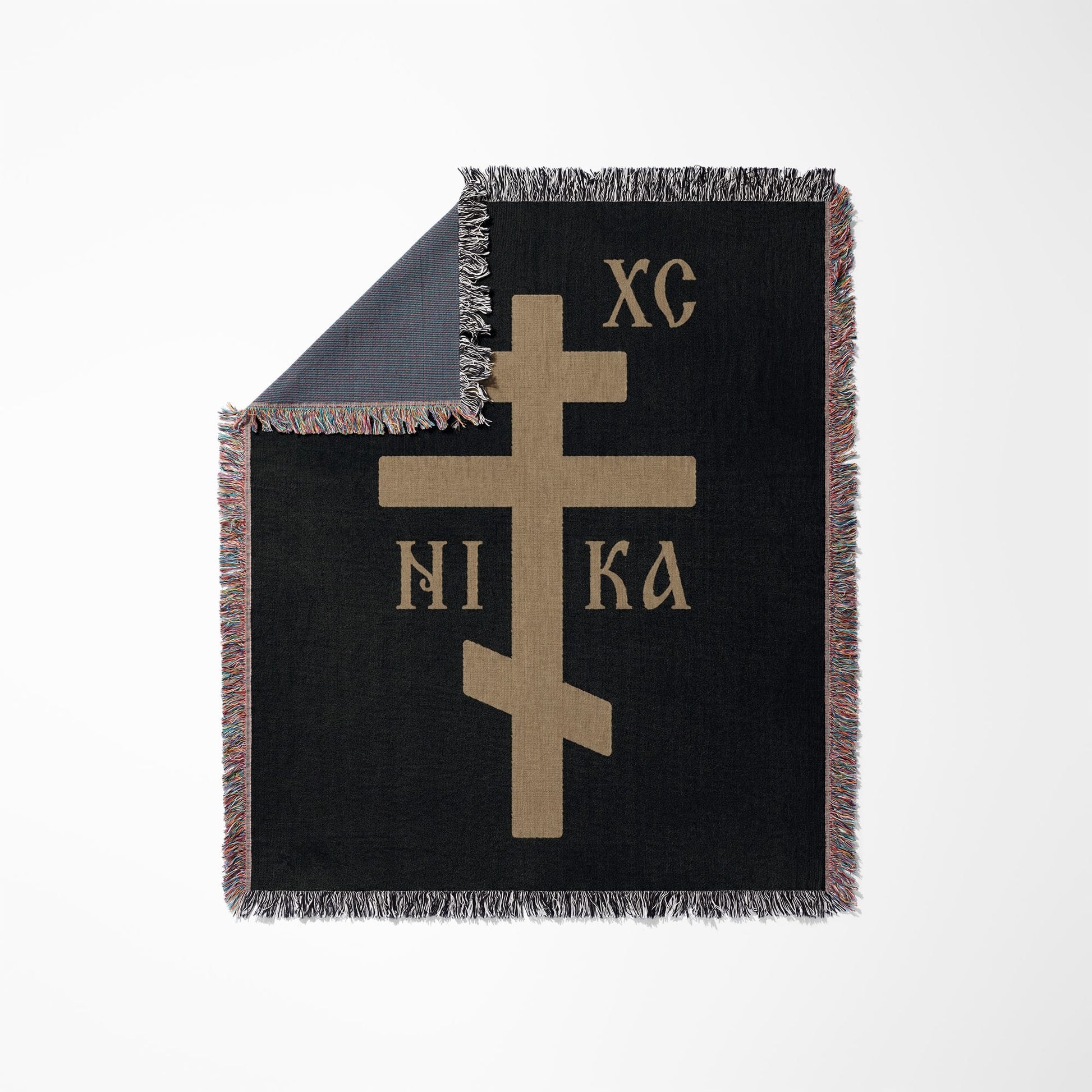 Black throw blanket with a tan Orthodox Christian cross and "XC NI KA".