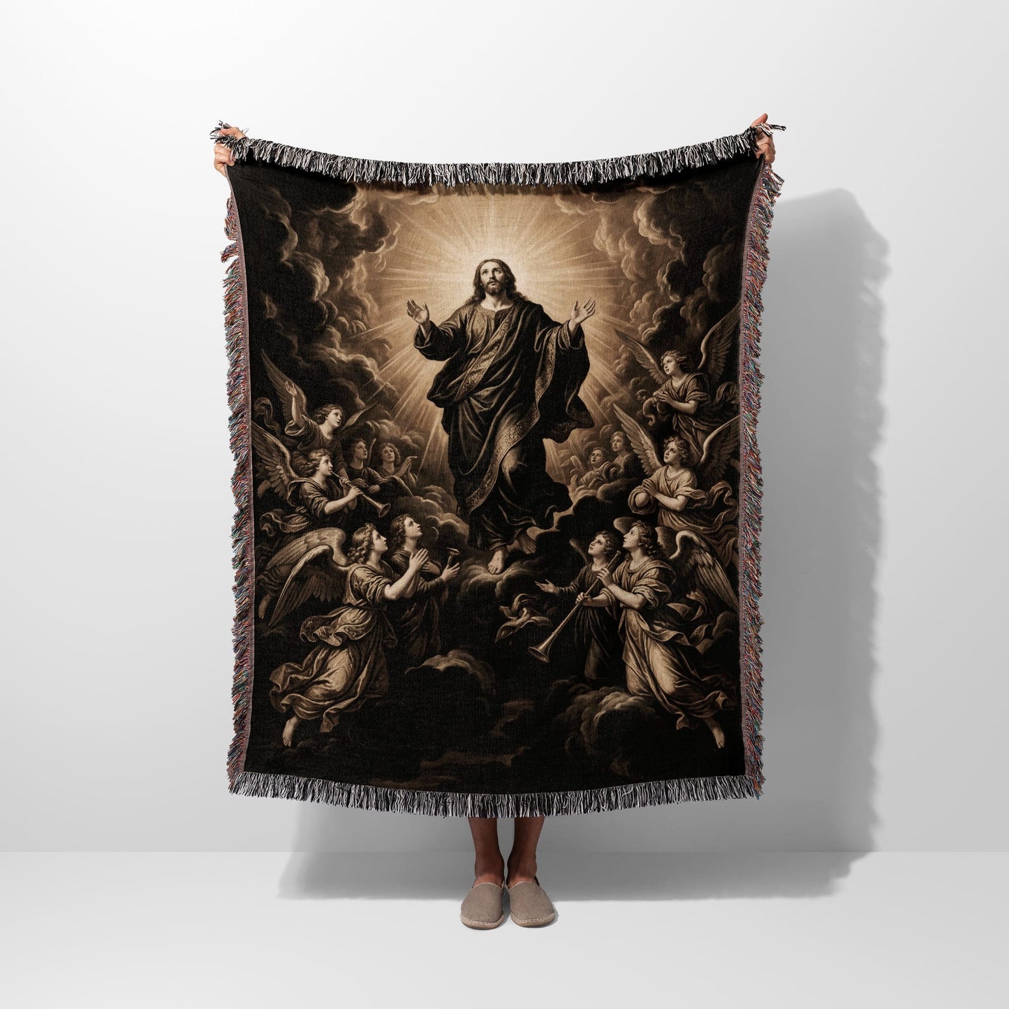 Jesus Christ with outstretched arms surrounded by angels, with fringed edges.