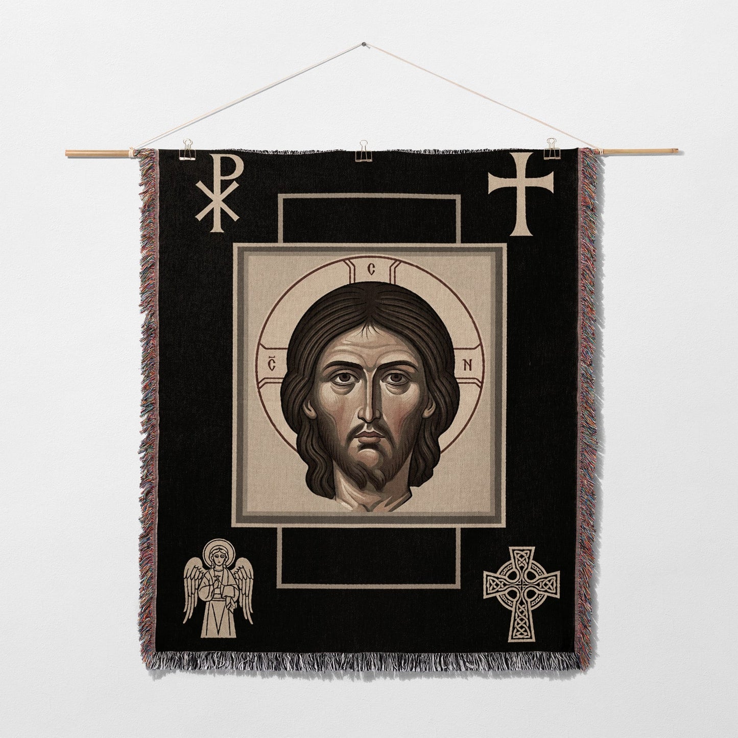 Religious tapestry featuring a portrait of Jesus Christ, with symbols of faith.