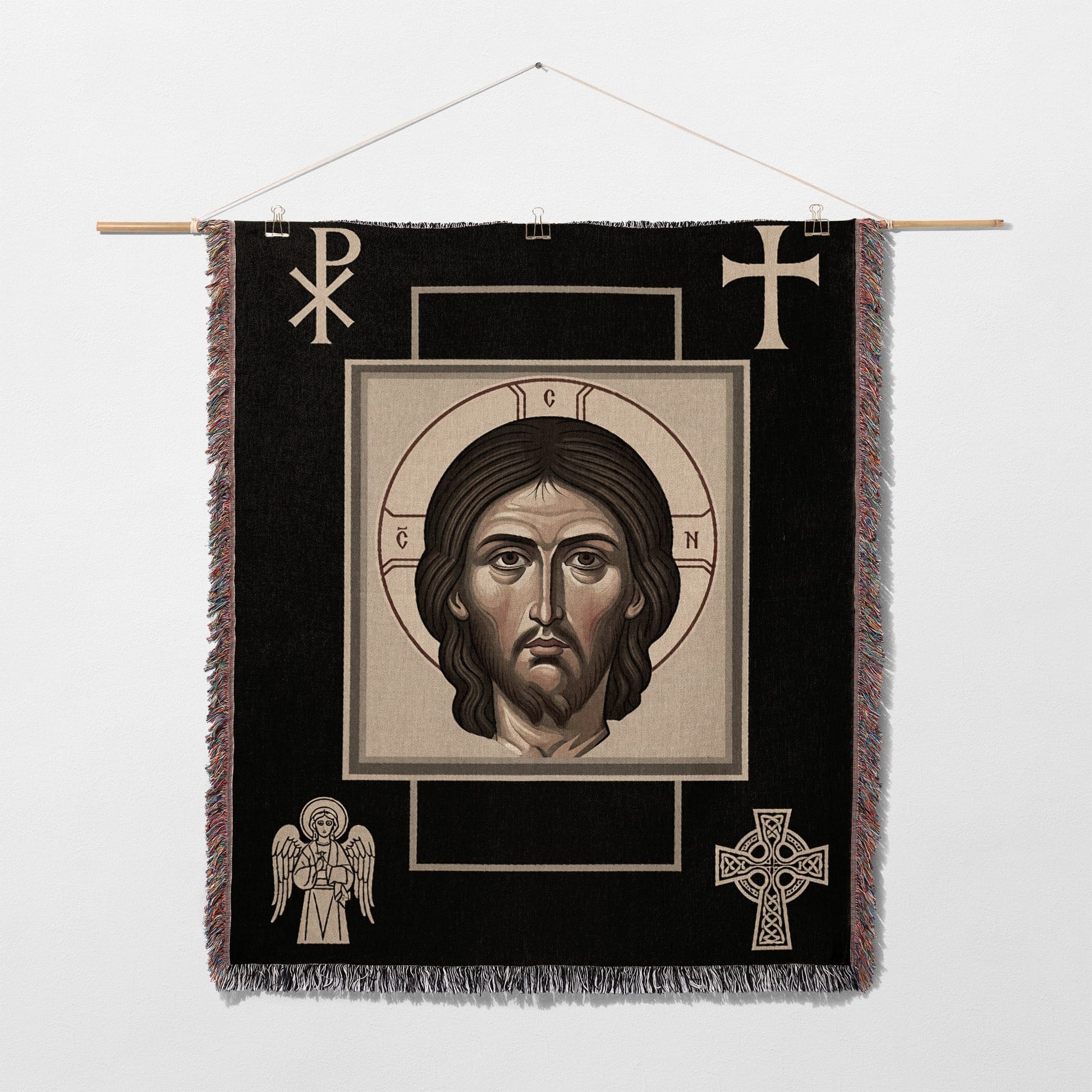 Religious tapestry featuring a portrait of Jesus Christ, with symbols of faith.